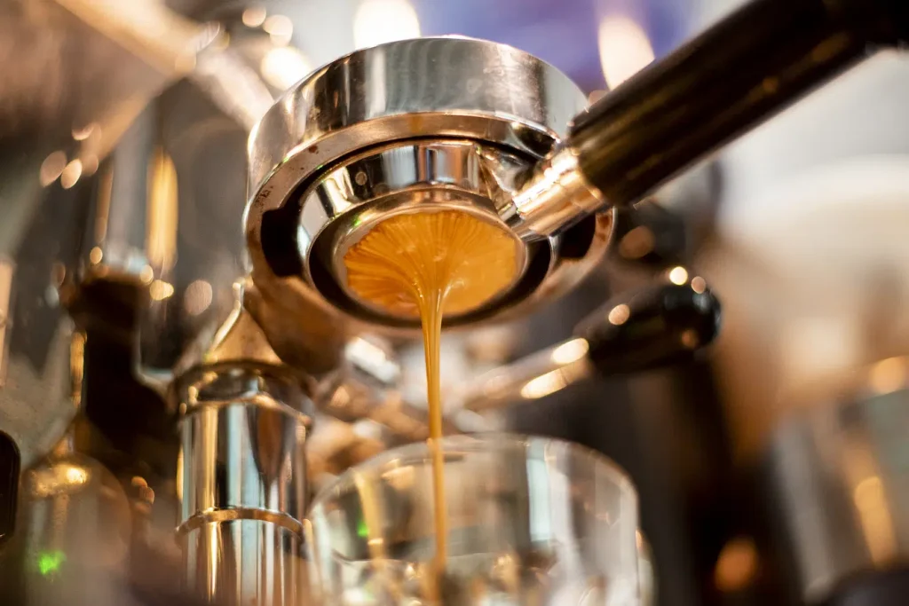 close-up the coffee machine is preparing the coffee shop