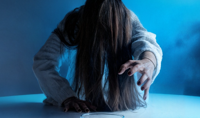 a person with disheveled hair and an outstretched arm takes a cup of coffee on a table below the text "me, before my first coffee".